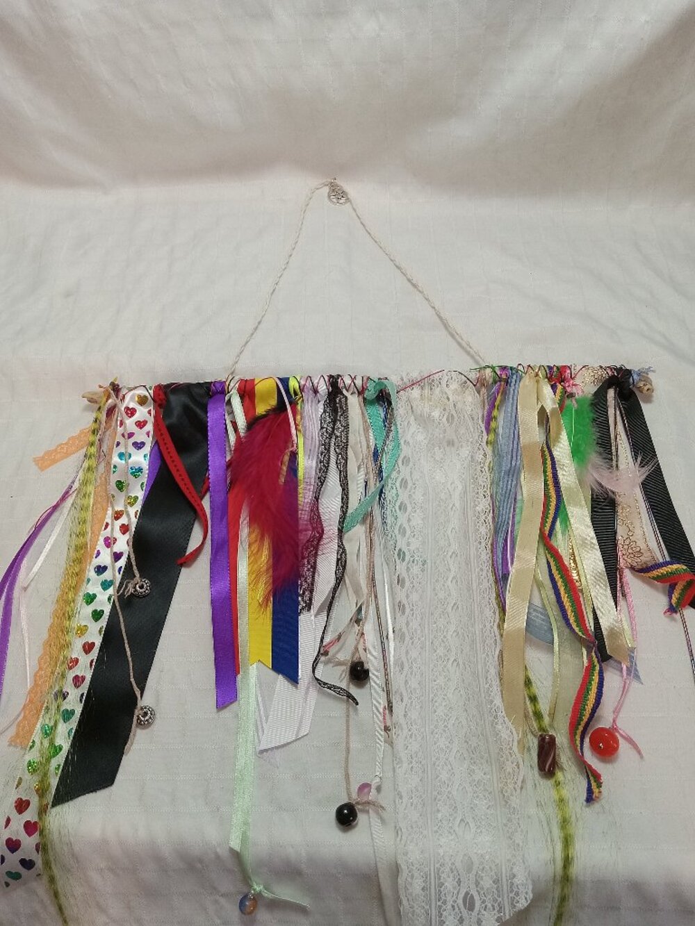 Handcrafted artistic banner made from treated driftwood, ribbons & decorations